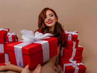 a teen girl with gift boxes
