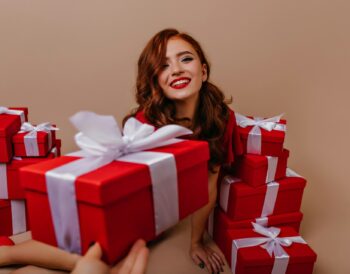 a teen girl with gift boxes