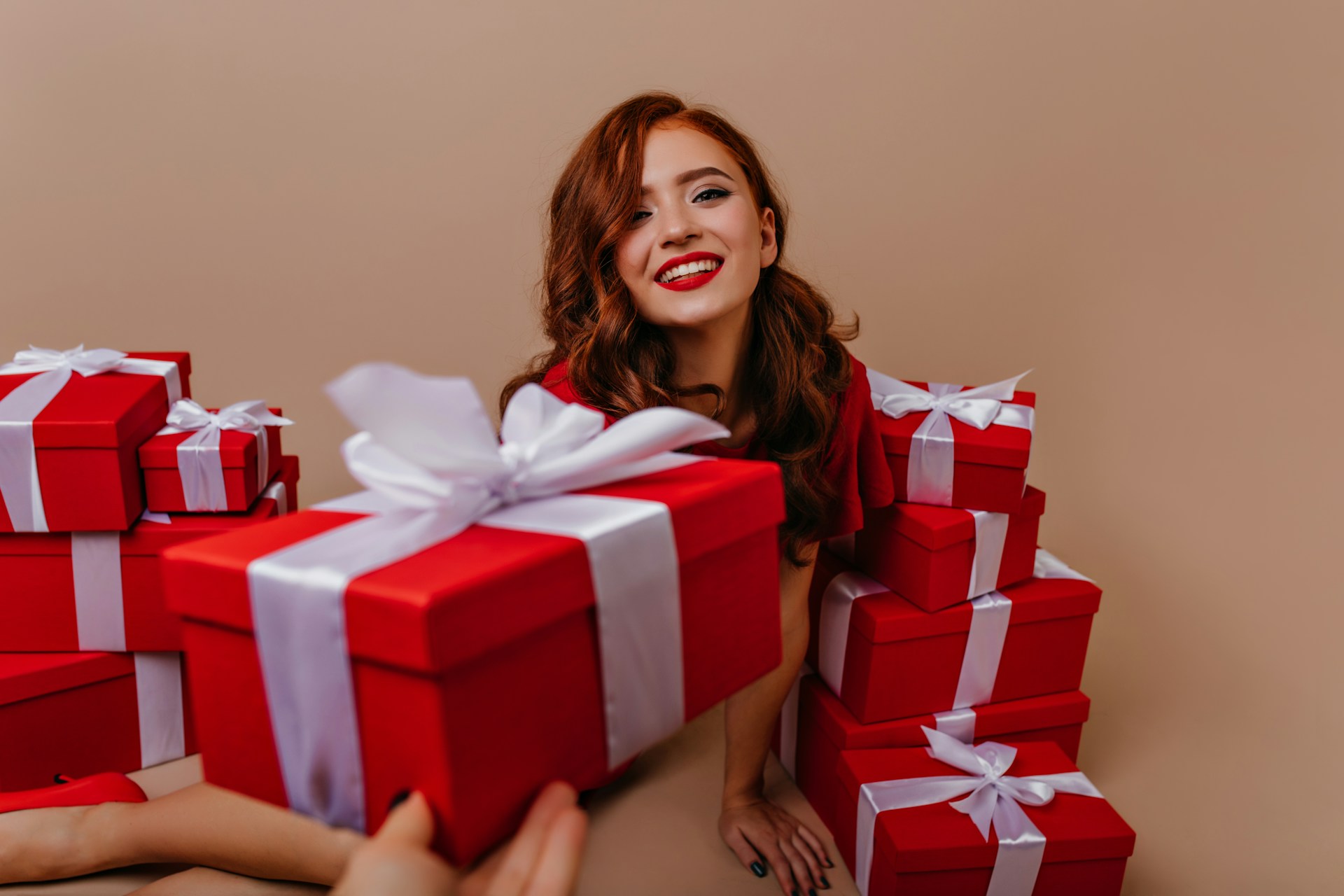 a teen girl with gift boxes